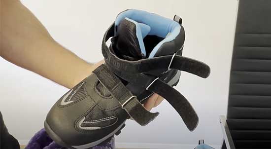 A pair of kids' snow boots with triple Velcro straps for easy on and off.