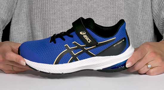 A pair of navy blue Asics shoes for boys with narrow feet.