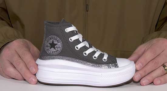 Converse high top shoe with higher platforms to add extra height.