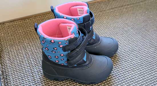 Narrow snow boots for girls with double velcro straps.