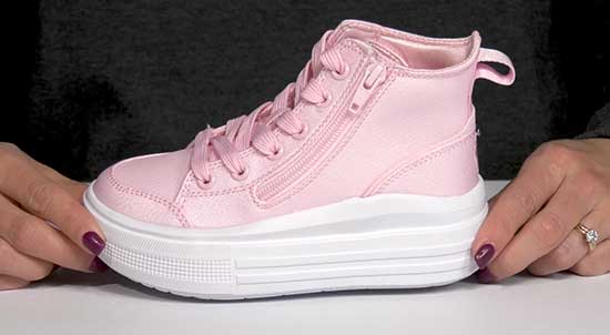 Pink high-top Skecher shoe with a higher platform to make kids look taller.