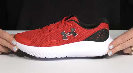 Red Under Armour shoes for boys with narrow feet.