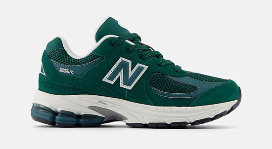 Supportive New Balance shoe with laces and green color.