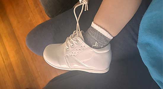 Supportive white ankle booties for toddlers.