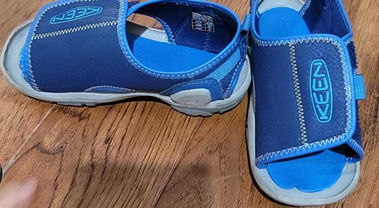 Navy blue open toe Keen sandals for kids.