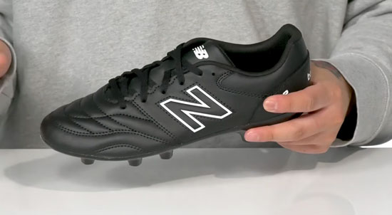 Supportive New Balance soccer cleat for kids.