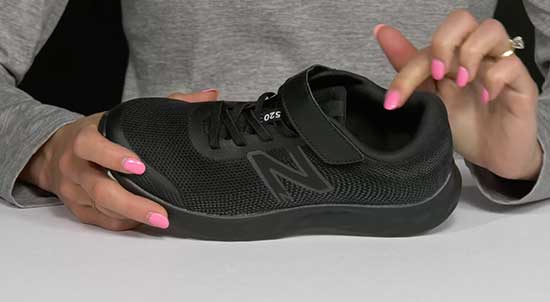 New Balance all black kids back to school shoe.