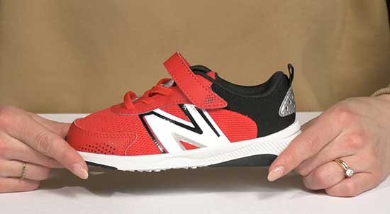 New Balance red shoe for toddlers with wide feet.