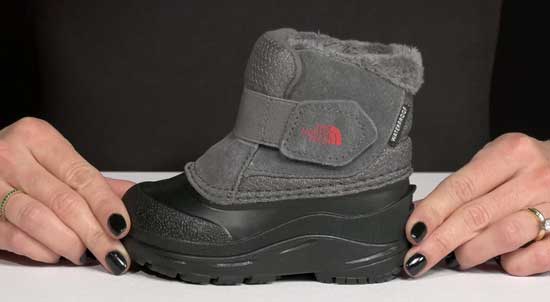 Waterproof and insulated North Face boot in grey for toddlers.