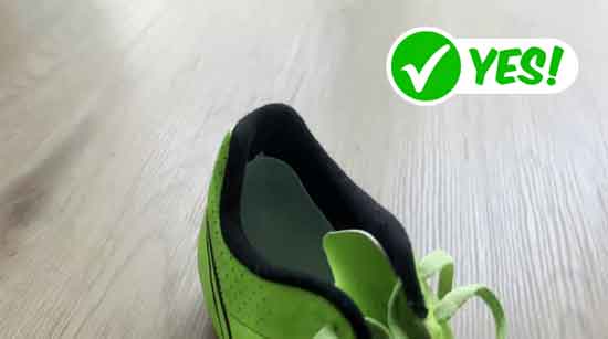 Heel cups that fit correctly inside a pair of kids' soccer cleats.