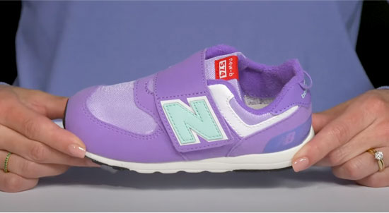 New Balance kids shoe style 574 in purple color for girls.