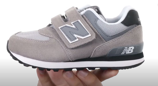 New Balance shoe style 574 in grey for boys.