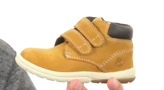 Supportive Timberland high-top boot for kids with flat feet.