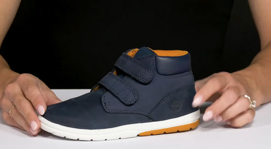 Supportive Timberland high-top boot for kids with flat feet.