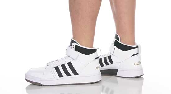 Adidas basketball shoes with Velcro closure.