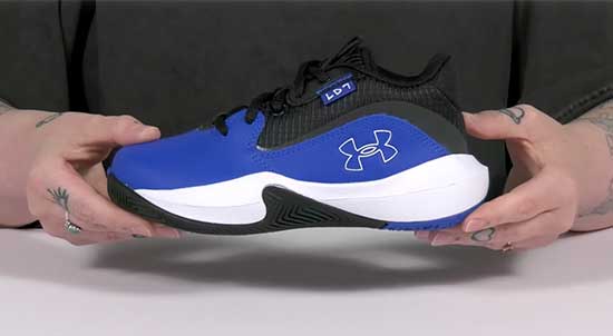 Blue Under Armour basketball shoes for boys.