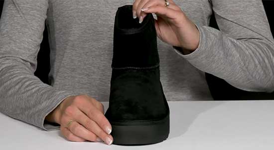 Waterproof black Ugg boots for kids.