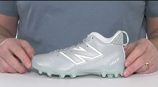 Wide width New Balance lacrosse cleats for kids with wide feet.