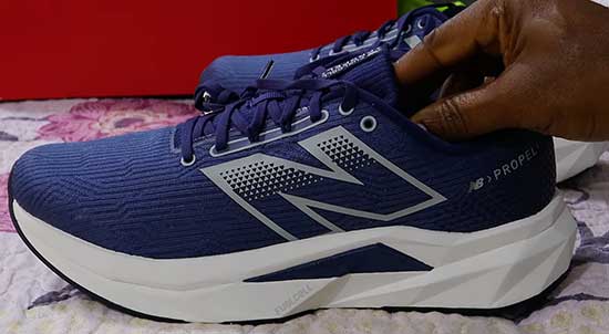New Balance running shoes for boys in men's shoe sizes.