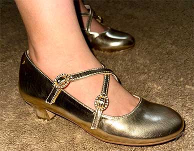 Gold high heel shoes for girls.