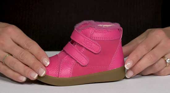 Pink Ugg boots for kids with AFOs.