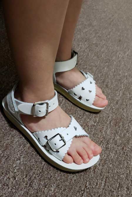 White salt water sandals for kids.