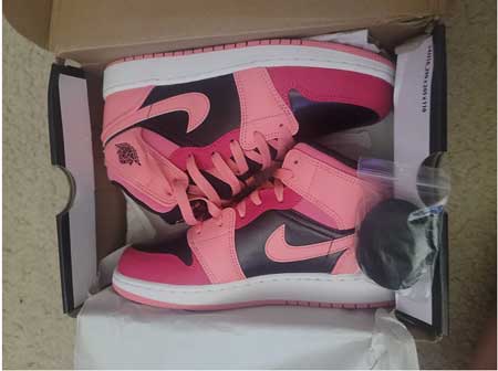 Wide pink Jordan shoes for girls.