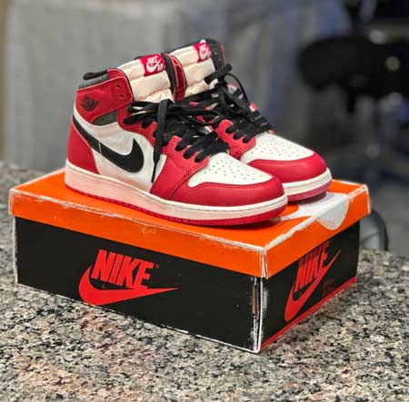 Wide red Jordan shoes for kids.