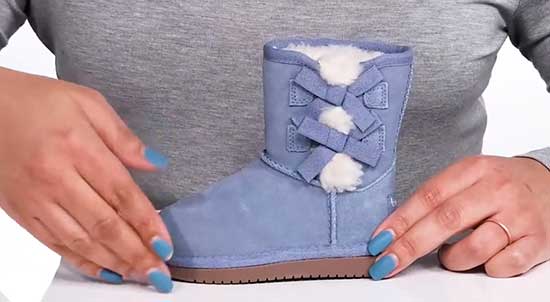 Koolaburra purple boots with bows on the side.