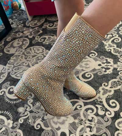 Sparkly high heel boots for girls.