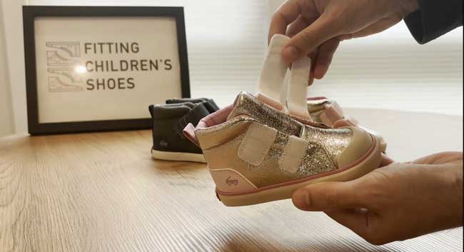 Adaptable See Kai Run shoe with extra long Velcro straps.