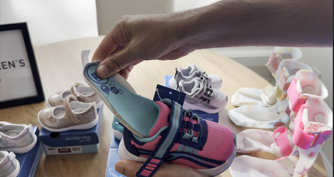 Adaptable Stride Rite shoe with removable insoles.