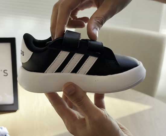 Black and white Adidas shoes for toddlers with wide feet.