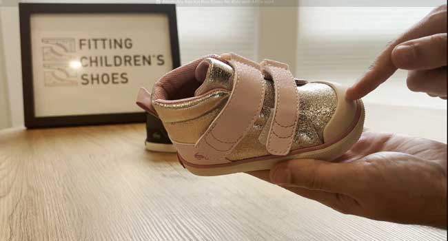 See Kai Run adaptable shoe for girls with a durable toe-box.