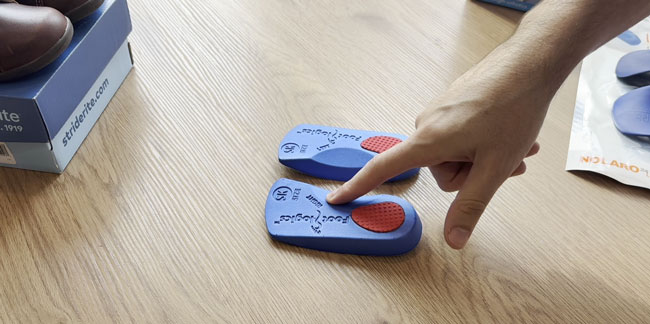 Footlogics 3/4-length orthotics with right and left labels on the bottom.