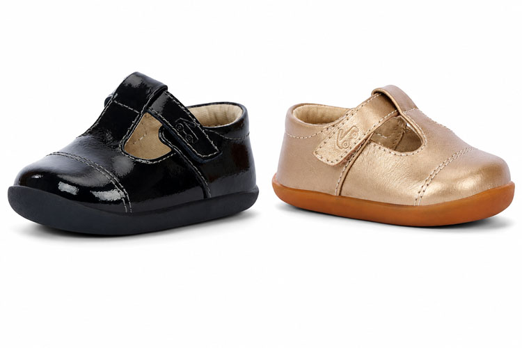 Black patent and gold baby T-strap shoes.
