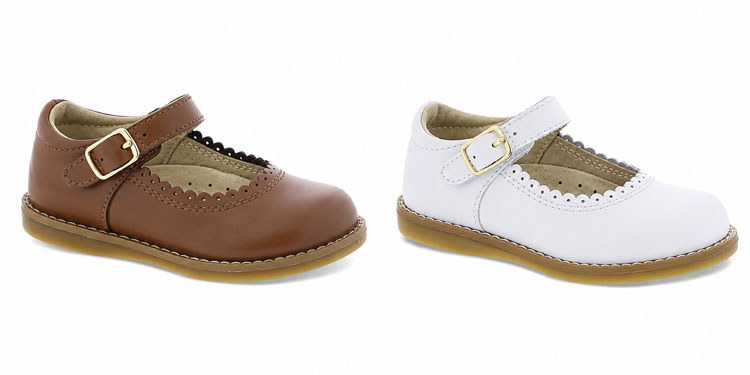 Brown and white kids' Mary Jane dress shoes displayed side by side on a white background.