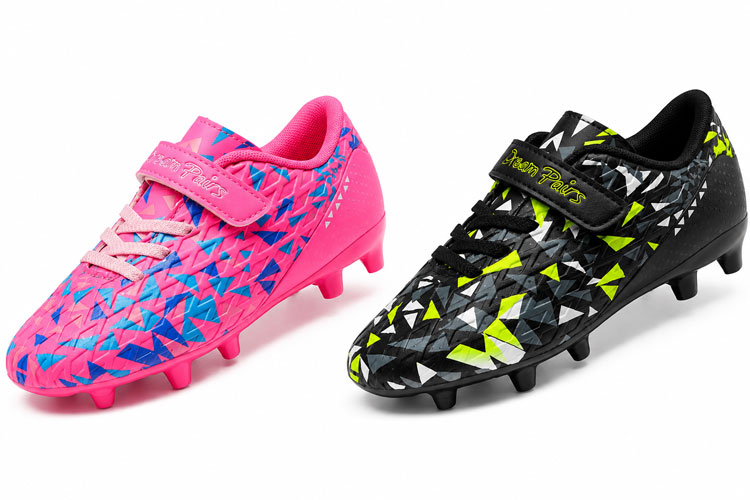 Pink and black Dream Pairs kids soccer cleats with Velcro closures displayed side by side on a white background. These lace-free soccer cleats are easy to put on and ideal for young players.