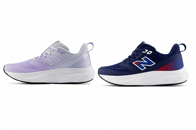 Navy and lavender New Balance lace-up kids sneakers displayed side by side. Available in wide and extra wide widths, these lightweight sneakers provide a comfortable, supportive fit for children with wider feet.