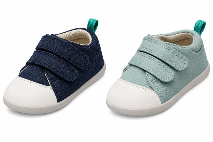 Navy and mint toddler canvas sneakers with double hook-and-loop straps and rounded white toe caps displayed side by side on a white background.
