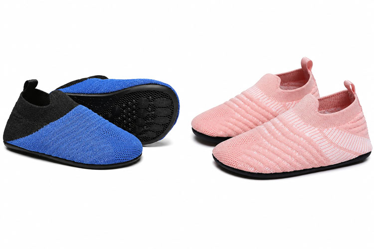 Wide slippers for kids with oversized openings and flexible slip-resistant soles.