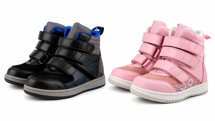 Black and pink orthopedic high-top shoes for kids with adjustable Velcro straps.