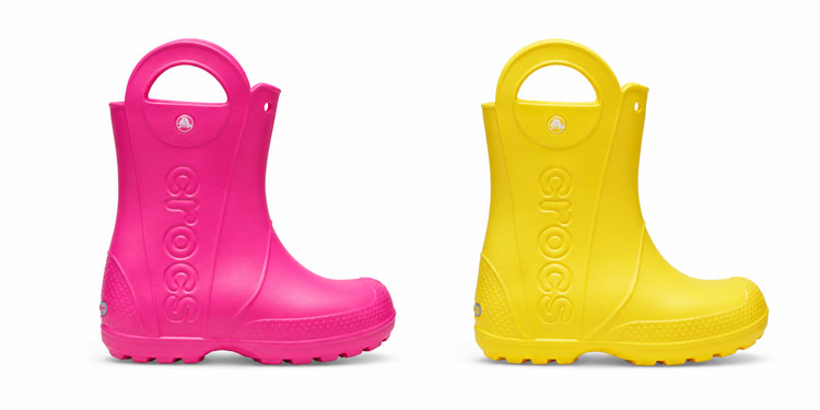 Crocs Handle It rain boots for kids with built-in handles and round toe boxes.
