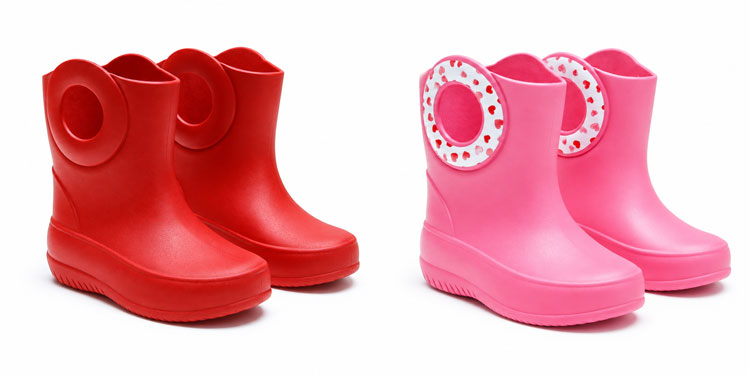 Wide rain boots for kids with oversized round handles for easy on and off.